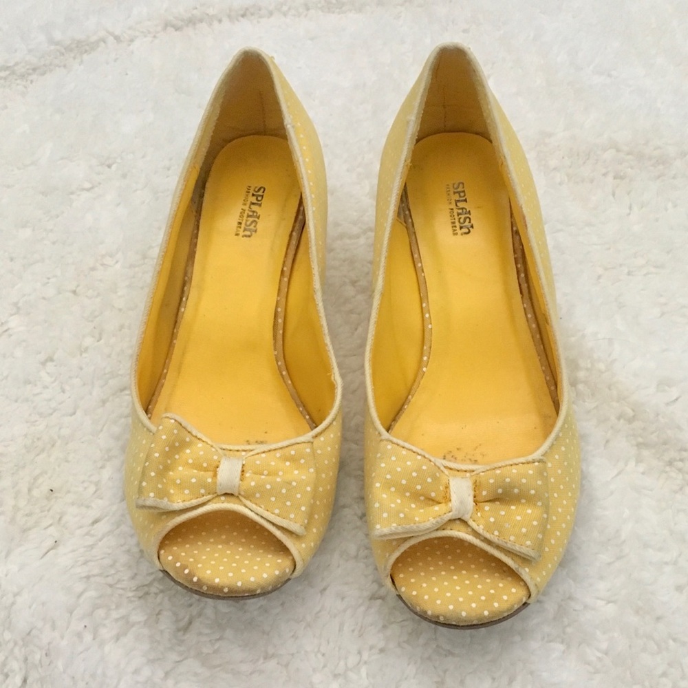 Yellow wedge heels with bow detail